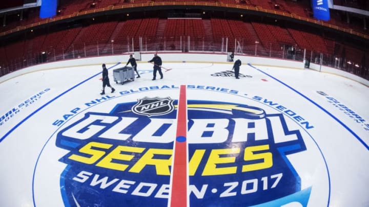 STOCKHOLM, SWEDEN - NOVEMBER 02: Members of the ice crew install logos and lines on the ice during the rink build out ahead of the SAP NHL Global Series between Ottawa Senators and Colorado Avalanche at Ericsson Globe on November 2, 2017 in Stockholm, Sweden. (Photo by Pontus Orre/NHLI via Getty Images)