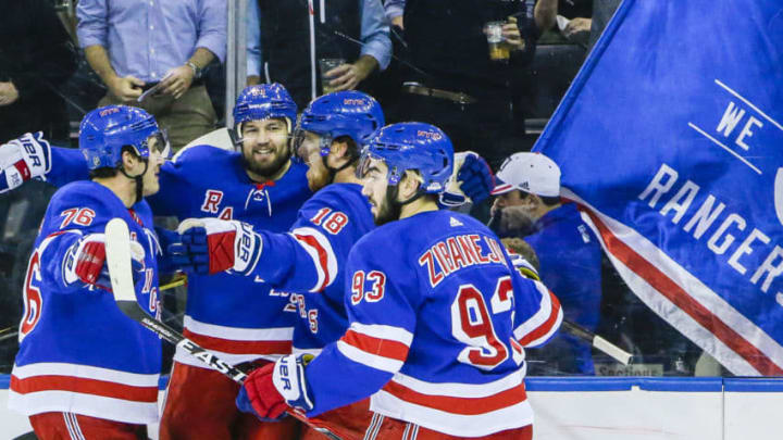 NEW YORK, NY - JANUARY 16: Ranger teammates congratulate New York Rangers Left Wing Rick Nash (61) after he scores goal during the Philadelphia Flyers and New York Rangers NHL game on January 16, 2018, at Madison Square Garden in New York, NY. (Photo by John Crouch/Icon Sportswire via Getty Images)