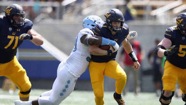 BERKELEY, CA – SEPTEMBER 01: Chase Garbers #7 of the California Golden Bears is tackled by Malik Carney #53 of the North Carolina Tar Heels at California Memorial Stadium on September 1, 2018 in Berkeley, California. (Photo by Ezra Shaw/Getty Images)