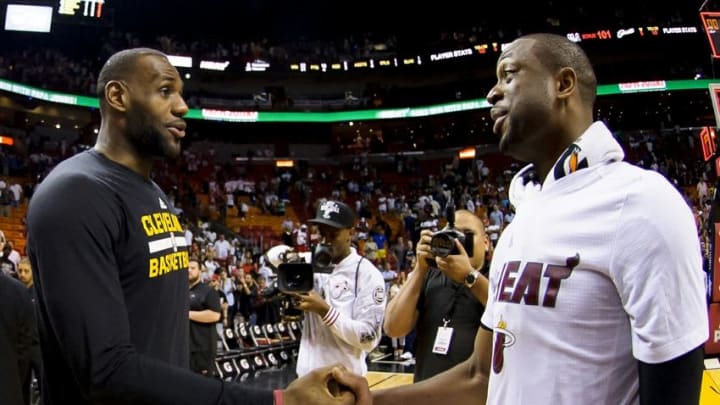 Mar 19, 2016; Miami, FL, USA; Cleveland Cavaliers forward LeBron James (left) talks with Miami Heat guard Dwyane Wade (right) after their game at American Airlines Arena. The Heat won 122-101. Mandatory Credit: Steve Mitchell-USA TODAY Sports