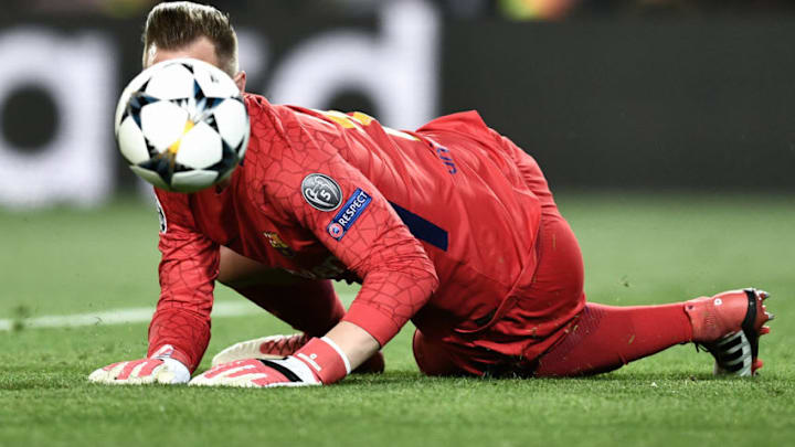 TOPSHOT - Barcelona's German goalkeeper Marc-Andre Ter Stegen dives to stop the ball during the UEFA Champions League quarter-final first leg football match between Barcelona and AS Roma at the Camp Nou Stadium in Barcelona on April 4, 2018. / AFP PHOTO / Filippo MONTEFORTE (Photo credit should read FILIPPO MONTEFORTE/AFP/Getty Images)