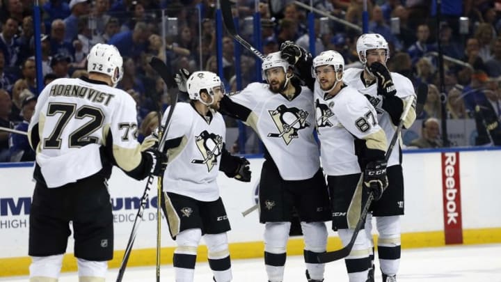 May 24, 2016; Tampa, FL, USA; Pittsburgh Penguins defenseman Kris Letang (58) is congratulated after he scored a goal against the Tampa Bay Lightning during the second period of game six of the Eastern Conference Final of the 2016 Stanley Cup Playoffs at Amalie Arena. Mandatory Credit: Kim Klement-USA TODAY Sports