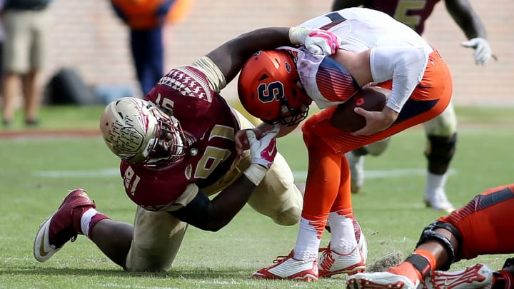 Oct 31, 2015; Tallahassee, FL, USA; Florida State’s defensive tackle Derrick Nnadi sacks Syracuse Orange quarterback Eric Dungey (2) at Doak Campbell Stadium. Florida State won 45-21. Mandatory Credit: Glenn Beil-USA TODAY Sports