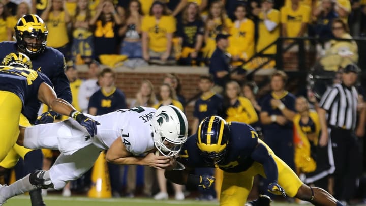 ANN ARBOR, MI – OCTOBER 07: Brian Lewerke #14 of the Michigan State Spartans runs for a touchdown during the first quarter of the game against against the Michigan Wolverines Michigan Stadium on October 7, 2017 in Ann Arbor, Michigan. (Photo by Leon Halip/Getty Images)