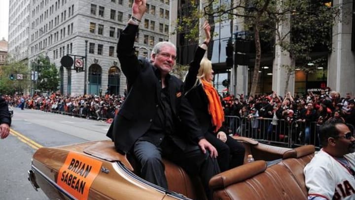 October 31, 2012; San Francisco, CA, USA; San Francisco Giants senior vice president and general manager Brian Sabean waves to the crowd while riding in a car during the World Series victory parade at Market Street. The Giants defeated the Detroit Tigers in a four-game sweep to win the 2012 World Series. Mandatory Credit: Kyle Terada-USA TODAY Sports