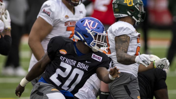 Feb 1, 2022; Mobile, AL, USA; National linebacker Kyron Johnson of Kansas (20) pursues a play during National practice for the 2022 Senior Bowl at Hancock Whitney Stadium. Mandatory Credit: Vasha Hunt-USA TODAY Sports