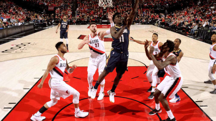 PORTLAND, OR - APRIL 17: Jrue Holiday #11 of the New Orleans Pelicans goes to the basket against the Portland Trail Blazers in Game Two of Round One of the 2018 NBA Playoffs on April 17, 2018 at the Moda Center in Portland, Oregon. NOTE TO USER: User expressly acknowledges and agrees that, by downloading and or using this Photograph, user is consenting to the terms and conditions of the Getty Images License Agreement. Mandatory Copyright Notice: Copyright 2018 NBAE (Photo by Cameron Browne/NBAE via Getty Images)
