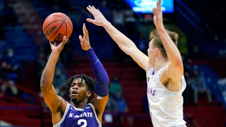 Feb 2, 2021; Lawrence, Kansas, USA; Kansas State Wildcats guard Selton Miguel (2) shoots against Kansas Jayhawks guard Christian Braun (2) during the second half at Allen Fieldhouse. Mandatory Credit: Jay Biggerstaff-USA TODAY Sports