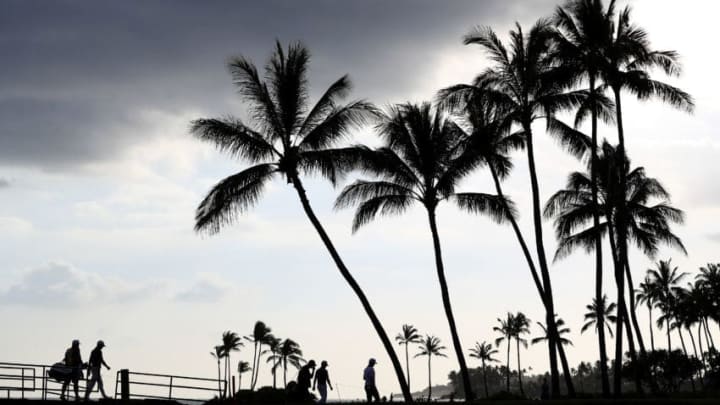 HONOLULU, HI - JANUARY 15: Justin Thomas of the United States, Zach Johnson of the United States and Justin Rose of England walk to the 17th green during the final round of the Sony Open In Hawaii at Waialae Country Club on January 15, 2017 in Honolulu, Hawaii. (Photo by Sean M. Haffey/Getty Images)