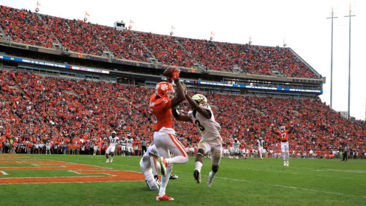 CLEMSON, SOUTH CAROLINA - NOVEMBER 16: Tee Higgins #5 of the Clemson Tigers catches a touchdown against Nasir Greer #3 of the Wake Forest Demon Deacons during their game at Memorial Stadium on November 16, 2019 in Clemson, South Carolina. (Photo by Streeter Lecka/Getty Images)