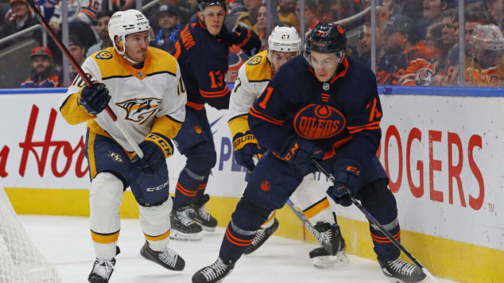 Nov 1, 2022; Edmonton, Alberta, CAN; Edmonton Oilers forward Ryan McLeod (71) looks to make a pass in front of Nashville Predators forward Colton Sissons (10) during the third period at Rogers Place. Mandatory Credit: Perry Nelson-USA TODAY Sports