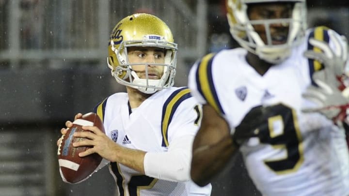 Oct 15, 2016; Pullman, WA, USA; UCLA Bruins quarterback Mike Fafaul (12) drops back for a pass against the Washington State Cougars during the first half at Martin Stadium. Mandatory Credit: James Snook-USA TODAY Sports