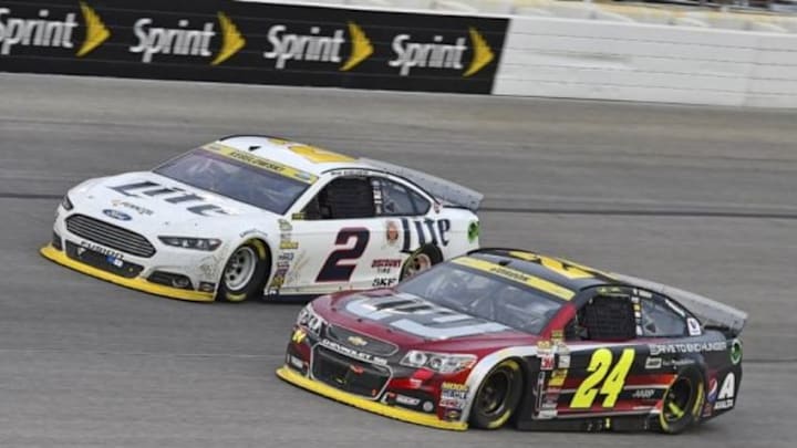 Nov 2, 2014; Fort Worth, TX, USA; NASCAR Sprint Cup Series driver Brad Keselowski (2) and NASCAR Sprint Cup Series driver Jeff Gordon (24) during the AAA Texas 500 at Texas Motor Speedway. Mandatory Credit: Jasen Vinlove-USA TODAY Sports