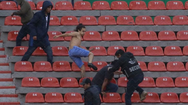 San Luis and Queretaro fans brawled in the stands at Estadio Alfonso Lastras in San Luis Potosí on Sunday. (Photo by Cesar Gomez/Jam Media/Getty Images)