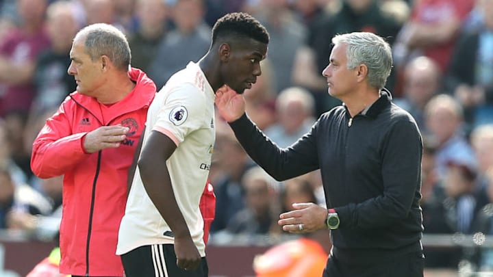 LONDON, ENGLAND - SEPTEMBER 29: Man Utd manager Jose Mourinho pats Paul Pogba of Man Utd on the back as he is subbed off during the Premier League match between West Ham United and Manchester United at London Stadium on September 29, 2018 in London, United Kingdom. (Photo by Charlotte Wilson/Offside/Getty Images)