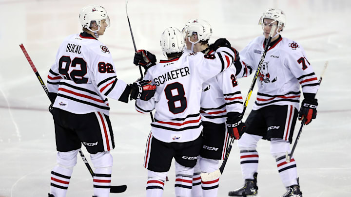 ST CATHARINES, ON – NOVEMBER 9: Philip Tomasino #26 of the Niagara IceDogs celebrates a goal with Daniel Bukac #82, Johnathon Schaefer #8 and Bradley Johnson #72 during the second period of an OHL game against the North Bay Battalion at Meridian Centre on November 9, 2018 in St Catharines, Canada. (Photo by Vaughn Ridley/Getty Images)