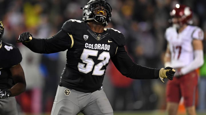 Nov 19, 2016; Boulder, CO, USA; Colorado Buffaloes defensive end Leo Jackson III (52) reacts to a strip sack fumble recovery in the fourth quarter against the Washington State Cougars at Folsom Field. The Buffaloes defeated the Cougars 38-24. Mandatory Credit: Ron Chenoy-USA TODAY Sports