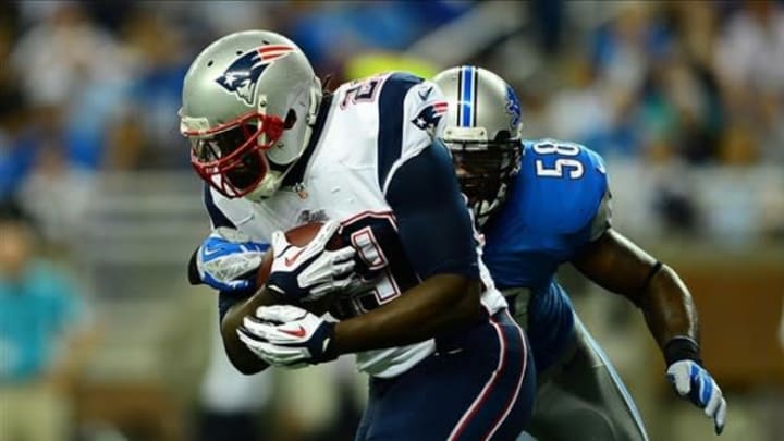 Aug 22, 2013; Detroit, MI, USA; New England Patriots running back LeGarrette Blount (29) is tackled by Detroit Lions outside linebacker Ashlee Palmer (58)in the second quarter of a preseason game at Ford Field. Mandatory Credit: Andrew Weber-USA TODAY Sports