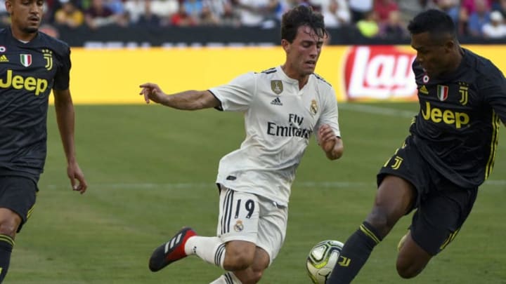 LANDOVER, MD - AUGUST 04:Real Madrid defender Ilvaro Odriozola (19) dribbles the ball against Juventus defender Alex Sandro (12) during an International Champions Cup match between Real Madrid and Juventus on August 4, 2018, at FedEx Field in Landover, MD. Real Madrid defeated Juventus 3-1. (Photo by Mark Goldman/Icon Sportswire via Getty Images)