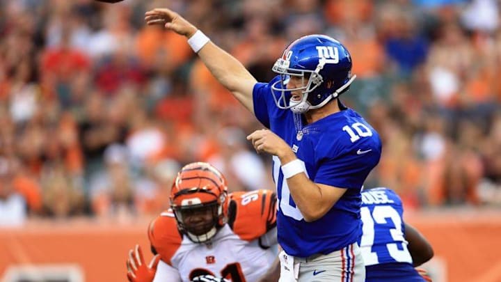 Aug 14, 2015; Cincinnati, OH, USA; New York Giants quarterback Eli Manning (10) throws a pass during the first quarter of a preseason NFL football game against the Cincinnati Bengals at Paul Brown Stadium. Mandatory Credit: Andrew Weber-USA TODAY Sports