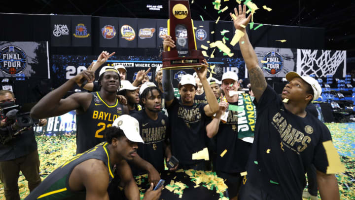 INDIANAPOLIS, INDIANA - APRIL 05: MaCio Teague #31 of the Baylor Bears holds up the trophy after defeating the Gonzaga Bulldogs 86-70 in the National Championship game of the 2021 NCAA Men's Basketball Tournament at Lucas Oil Stadium on April 05, 2021 in Indianapolis, Indiana. (Photo by Jamie Squire/Getty Images)