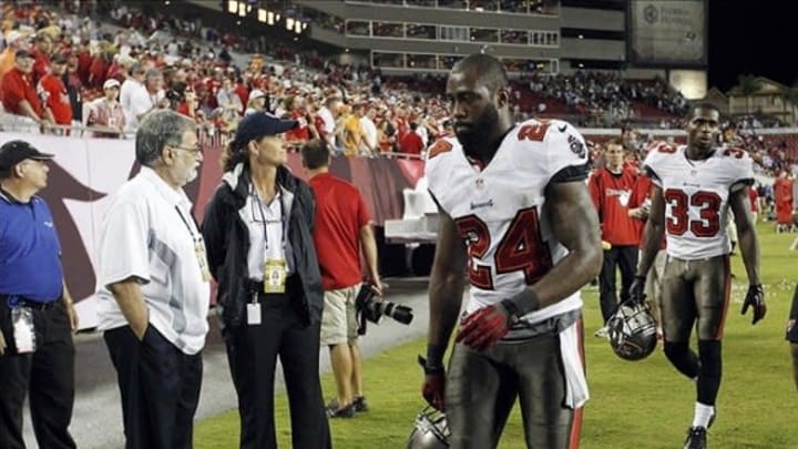 Sep 15, 2013; Tampa, FL, USA; Tampa Bay Buccaneers cornerback Darrelle Revis (24) reacts as he leaves the field after they lost to the New Orleans Saints at Raymond James Stadium. The Saints won 16-14. Mandatory Credit: Kim Klement-USA TODAY Sports