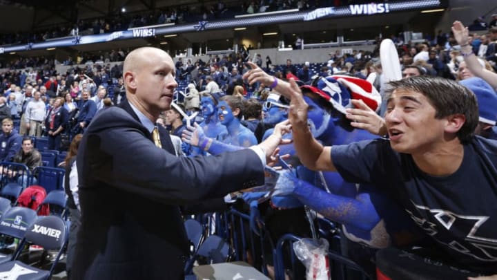 CINCINNATI, OH - NOVEMBER 13: Head coach Chris Mack of the Xavier Musketeers celebrates with fans after the game against the Butler Bulldogs at Cintas Center on November 13, 2012 in Cincinnati, Ohio. Xavier won 62-47. (Photo by Joe Robbins/Getty Images)
