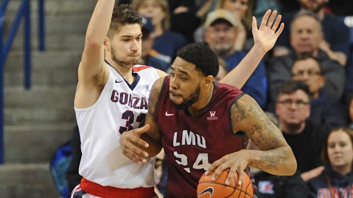 Jan 12, 2017; Spokane, WA, USA; Loyola Marymount Lions forward Shamar Johnson (24) works the baseline against Gonzaga Bulldogs forward Killian Tillie (33) during the first half at McCarthey Athletic Center. Mandatory Credit: James Snook-USA TODAY Sports