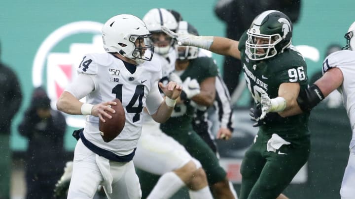 EAST LANSING, MI – OCTOBER 26: Quarterback Sean Clifford #14 of the Penn State Nittany Lions looks to pass the ball against defensive end Jacub Panasiuk #96 of the Michigan State Spartans during the first half at Spartan Stadium on October 26, 2019 in East Lansing, Michigan. Penn State defeated Michigan State 28-7. (Photo by Duane Burleson/Getty Images)
