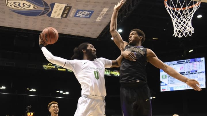 March 10, 2016; Las Vegas, NV, USA; Oregon Ducks forward Dwayne Benjamin (0) shoots the basketball against Washington Huskies forward Marquese Chriss (0) during the second half of the Pac-12 Conference tournament at MGM Grand Garden Arena. The Ducks defeated the Huskies 83-77. Mandatory Credit: Kyle Terada-USA TODAY Sports