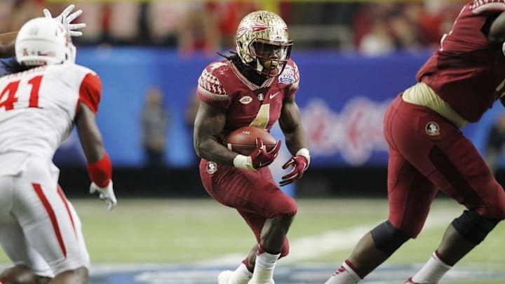 Dec 31, 2015; Atlanta, GA, USA; Florida State Seminoles running back Dalvin Cook (4) carries the ball against the Houston Cougars in the third quarter in the 2015 Chick-fil-A Peach Bowl at the Georgia Dome. The Cougars won 38-24. Mandatory Credit: Brett Davis-USA TODAY Sports