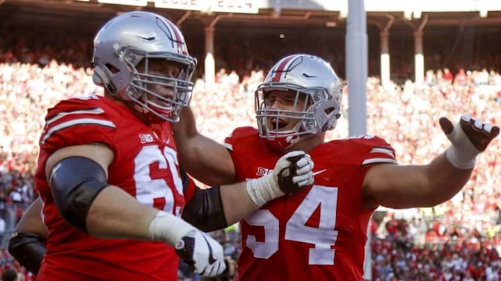 Oct 8, 2016; Columbus, OH, USA; Ohio State Buckeyes offensive lineman Billy Price (54) celebrates the block that sprung a touchdown with offensive lineman Pat Elflein (65) during the 2nd quarter against the Indiana Hoosiers at Ohio Stadium. Ohio State Buckeyes lead 24-10 at half. Mandatory Credit: Joe Maiorana-USA TODAY Sports