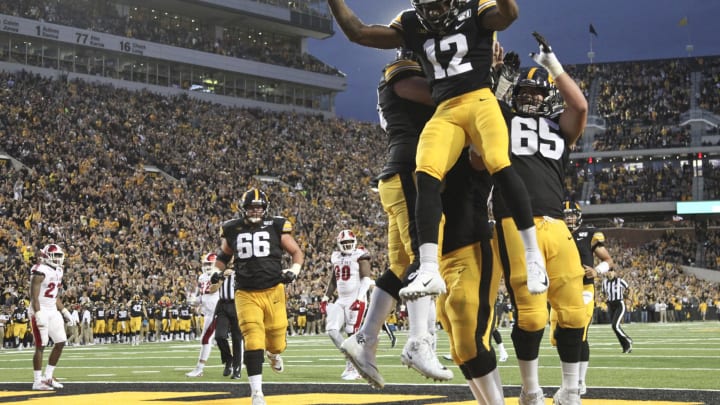 IOWA CITY, IOWA- AUGUST 31: Wide receiver Brandon Smith #12 of the Iowa Hawkeyes celebrates a touchdown reception in the first half against the Miami Ohio RedHawks on August 31, 2019 at Kinnick Stadium in Iowa City, Iowa. (Photo by Matthew Holst/Getty Images)