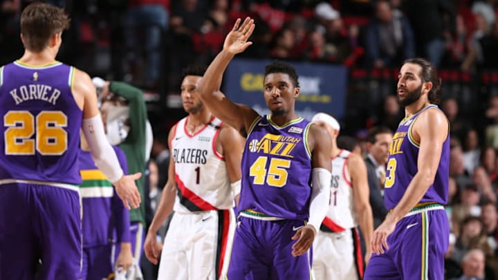 PORTLAND, OR - DECEMBER 21: Donovan Mitchell #45 of the Utah Jazz looks on during the game against the Portland Trail Blazers on December 21, 2018 at the Moda Center Arena in Portland, Oregon. NOTE TO USER: User expressly acknowledges and agrees that, by downloading and or using this photograph, user is consenting to the terms and conditions of the Getty Images License Agreement. Mandatory Copyright Notice: Copyright 2018 NBAE (Photo by Sam Forencich/NBAE via Getty Images)