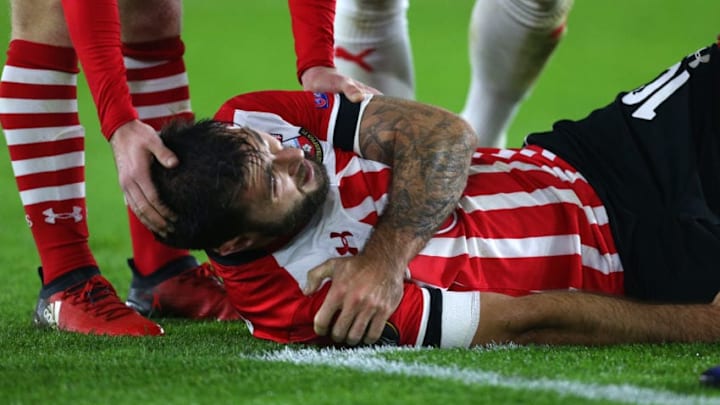 SOUTHAMPTON, ENGLAND - DECEMBER 08: An injured Charlie Austin of Southampton holds his shoulder before he is substituted during the UEFA Europa League match between Southampton FC and Hapoel Beer-Sheva FC at St Mary's Stadium on December 8, 2016 in Southampton, England. (Photo by Catherine Ivill - AMA/Getty Images)