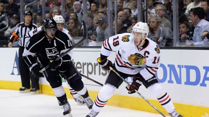 LOS ANGELES, CA - MAY 24: Jonathan Toews #19 of the Chicago Blackhawks with the puck against Anze Kopitar #11 of the Los Angeles Kings in the second period in Game Three of the Western Conference Final during the 2014 Stanley Cup Playoffs at Staples Center on May 24, 2014 in Los Angeles, California. (Photo by Harry How/Getty Images)
