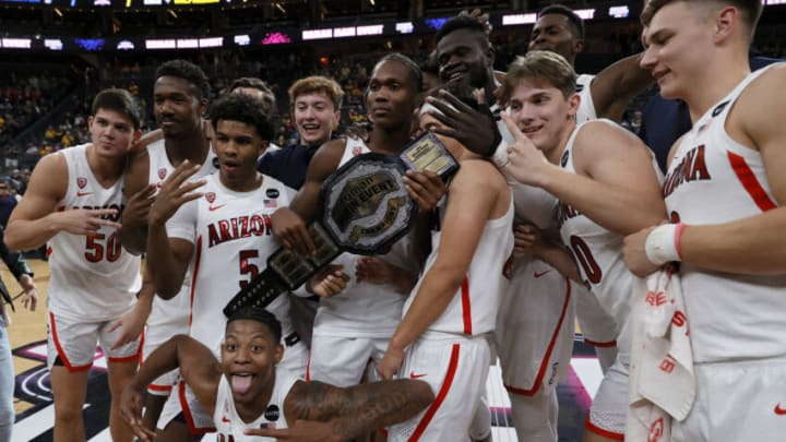 LAS VEGAS, NEVADA - NOVEMBER 21: The Arizona Wildcats celebrate their 80-62 victory over the Michigan Wolverines to win the championship game of the Roman Main Event basketball tournament at T-Mobile Arena on November 21, 2021 in Las Vegas, Nevada. (Photo by Ethan Miller/Getty Images)