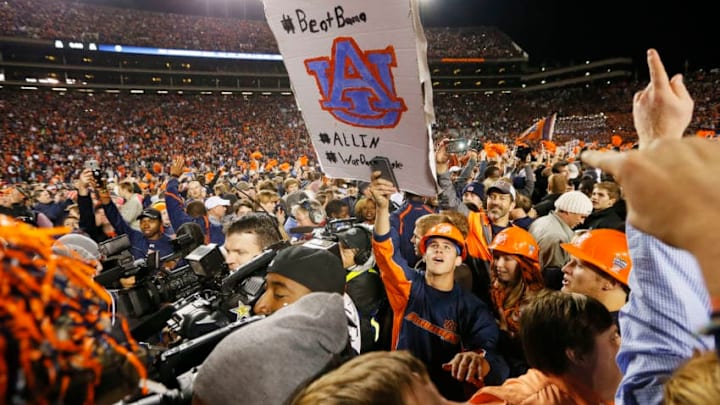 AUBURN, AL - NOVEMBER 30: Fans take the field to celebrate with the Auburn Tigers after they defeated the Alabama Crimson Tide 34 to 28 at Jordan-Hare Stadium on November 30, 2013 in Auburn, Alabama. (Photo by Kevin C. Cox/Getty Images) AUBURN, AL - NOVEMBER 30: Fans take the field to celebrate with the Auburn Tigers after they defeated the Alabama Crimson Tide 34 to 28 at Jordan-Hare Stadium on November 30, 2013 in Auburn, Alabama. (Photo by Kevin C. Cox/Getty Images)