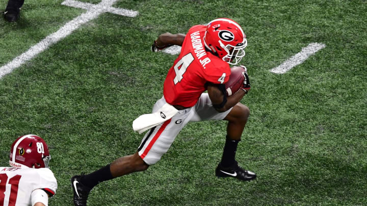 ATLANTA, GA – JANUARY 08: Mecole Hardman #4 of the Georgia Bulldogs carries the ball against the Alabama Crimson Tide in the CFP National Championship presented by AT&T at Mercedes-Benz Stadium on January 8, 2018 in Atlanta, Georgia. (Photo by Scott Cunningham/Getty Images)