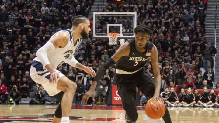 SAN DIEGO, CA - FEBRUARY 20: San Diego State University Aztecs forward Jalen McDaniels (5) is guarded by Nevada Wolf Pack forward Cody Martin (11)during the game between the Nevada Wolf Pack and the San Diego State University Aztecs on February 20, 2019 at the Steve Fisher Court at Viejas Arena in San Diego, California. (Photo by Alan Smith/Icon Sportswire via Getty Images)