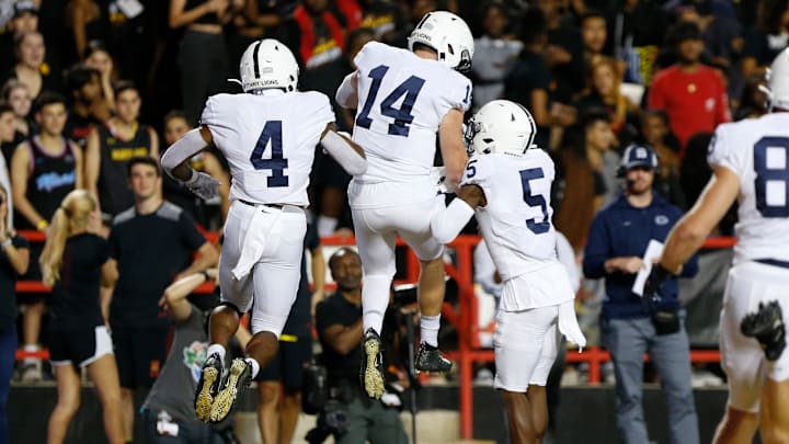 Sep 27, 2019; College Park, MD, USA; Penn State Nittany Lions quarterback Sean Clifford (14) celebrates with Nittany Lions wide receiver Jahan Dotson (5) after scoring a touchdown against the Maryland Terrapins in the first quarter at Capital One Field at Maryland Stadium. Mandatory Credit: Geoff Burke-USA TODAY Sports