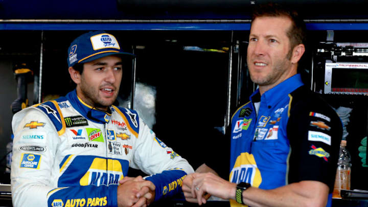 WATKINS GLEN, NEW YORK - AUGUST 03: Chase Elliott, driver of the #9 NAPA AUTO PARTS Chevrolet, stands in the garage with Crew Chief Alan Gustafson during practice for the Monster Energy NASCAR Cup Series Go Bowling at The Glen at Watkins Glen International on August 03, 2019 in Watkins Glen, New York. (Photo by Sean Gardner/Getty Images)