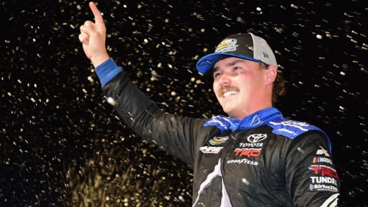 HOMESTEAD, FL - NOVEMBER 16: Brett Moffitt, driver of the #16 AISIN Group Toyota, celebrates in victory lane after winning the NASCAR Camping World Truck Series Ford EcoBoost 200 and the NASCAR Camping World Truck Series Championship at Homestead-Miami Speedway on November 16, 2018 in Homestead, Florida. (Photo by Jared C. Tilton/Getty Images)