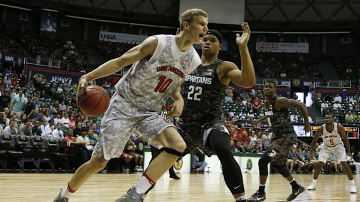 Nov 11, 2016; Honolulu, HI, USA; Arizona Wildcats forward Lauri Markkanen (10) drives to the basket against Michigan State Spartans forward Miles Bridges (22) at the Stan Sheriff Center . Mandatory Credit: Brian Spurlock-USA TODAY Sports