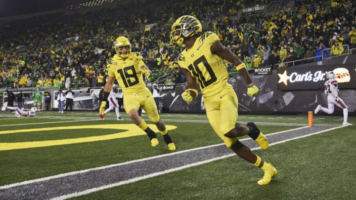 Sep 18, 2021; Athens, Georgia, USA; Oregon Ducks wide receiver Dont'e Thornton (10) celebrates with tight end Terrance Ferguson (19) after scoring a touchdown during the second half against the Stony Brook Seawolves at Sanford Stadium. Mandatory Credit: Joshua L. Jones/Athens Banner-Herald via USA TODAY NETWORK