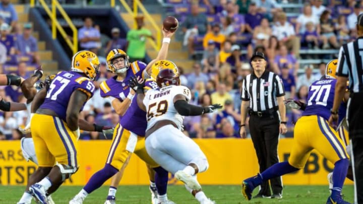 Sep 18, 2021; Baton Rouge, LA, USA; LSU Tigers quarterback Max Johnson (14) throws a pass over Central Michigan Chippewas defensive lineman Tico Brown (59) at Tiger Stadium.Ncaa Football Central Michigan At Louisiana State