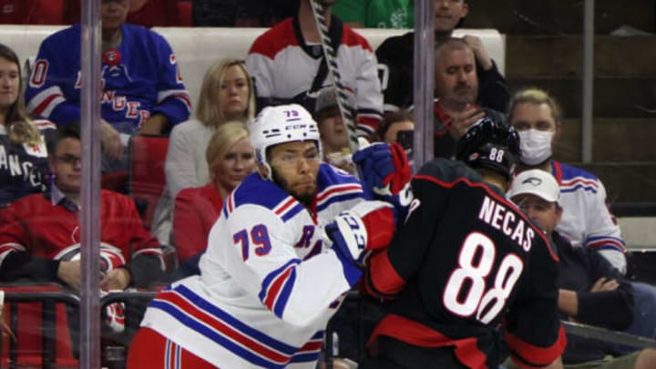 RALEIGH, NORTH CAROLINA – MAY 26: K’Andre Miller #79 of the New York Rangers checks Martin Necas #88 of the Carolina Hurricanes in Game Five of the Second Round of the 2022 Stanley Cup Playoffs at PNC Arena on May 26, 2022, in Raleigh, North Carolina. (Photo by Bruce Bennett/Getty Images)