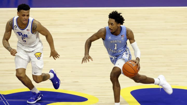 Jan 26, 2021; Pittsburgh, Pennsylvania, USA; North Carolina Tar Heels guard Leaky Black (1) dribbles on a fast break against Pittsburgh Panthers guard Au'diese Toney (5) during the second half at the Petersen Events Center. Mandatory Credit: Charles LeClaire-USA TODAY Sports
