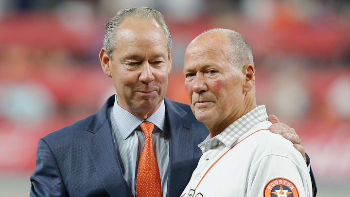 HOUSTON, TX – APRIL 03: Houston Astros owner Jim Crane presents retired first base coach Rich Dauer with his championship ring at Minute Maid Park on April 3, 2018 in Houston, Texas. Dauer almost died from a subdural hematoma during the championship parade. (Photo by Bob Levey/Getty Images)