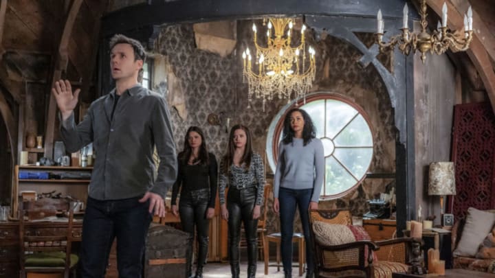 Charmed - "Don't Look Back in Anger"- -- Image Number: CMD218A_0564b2 -- Pictured (L- R): Rupert Evans as Harry Greenwood, Melonie Diaz as Melanie Vera, Sarah Jeffery as Maggie Vera and Madeleine Mantock as Macy Vaughn -- Photo: Colin Bentley/The CW -- © 2020 The CW Network, LLC. All Rights Reserved.